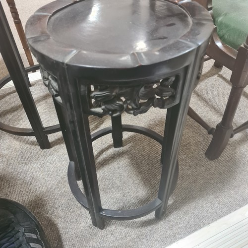 68 - A nest of 4 Chinese circular hardwood occasional tables, with carved friezes, largest table diameter... 