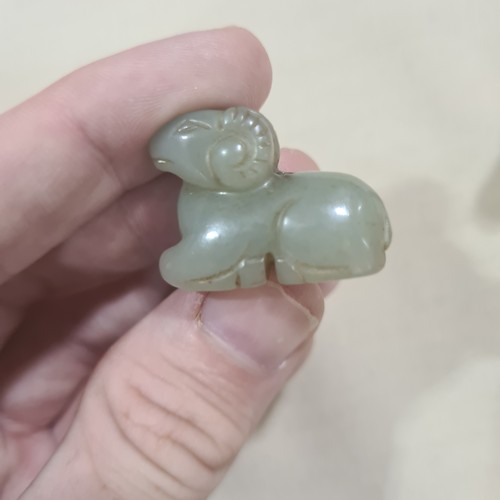 85 - 3 Chinese jade carvings, comprising a reclining figure (length 8cm), a mythical creature, and a Qili... 