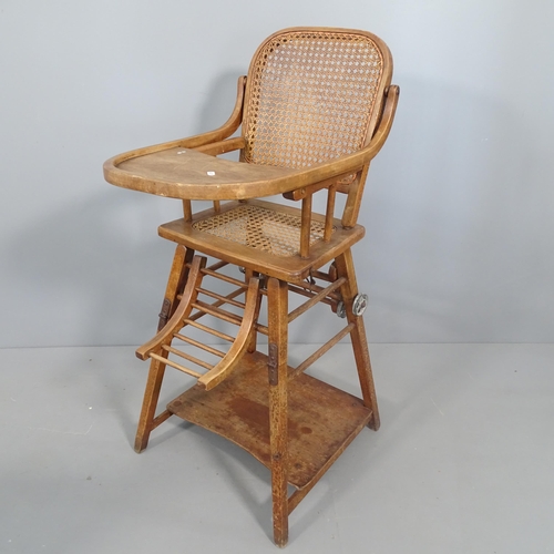 2252 - An antique metamorphic child's high chair with cane seat. 48x92x55cm.