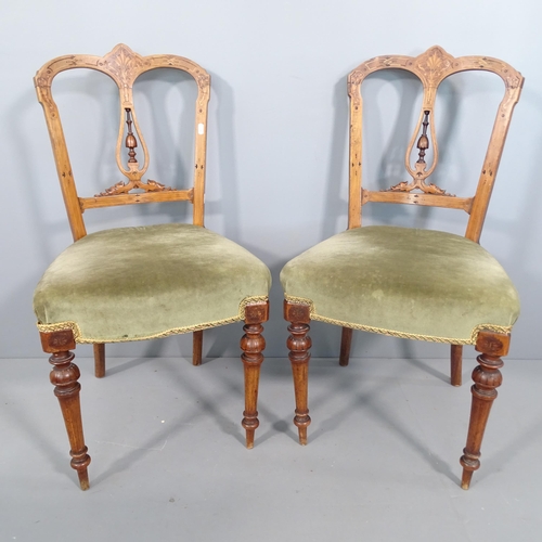 2255 - A pair of continental walnut and satinwood inlaid side chairs.