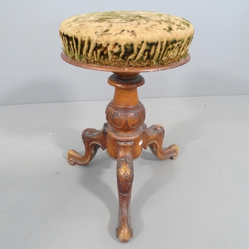 2256 - A Victorian walnut rise and fall piano stool on tripod base.