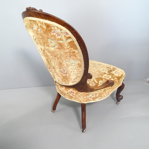 2261 - A Victorian walnut and upholstered spoon back nursing chair.