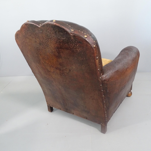 2262 - An antique French studded leather upholstered club chair.