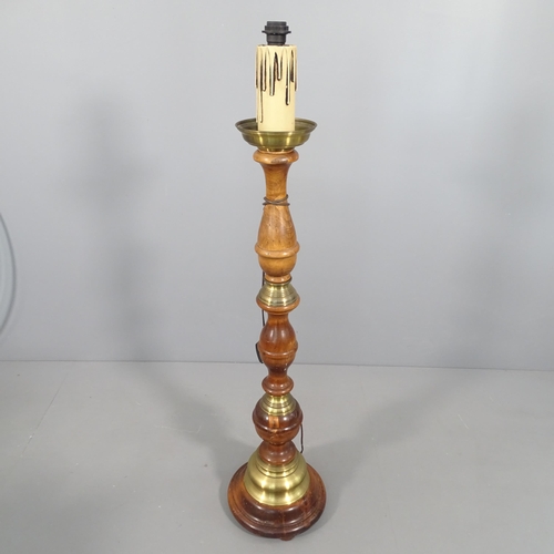 2266 - A turned mahogany and brass mounted standard lamp. H to screw fitting - 134cm.