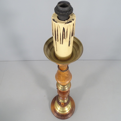 2266 - A turned mahogany and brass mounted standard lamp. H to screw fitting - 134cm.