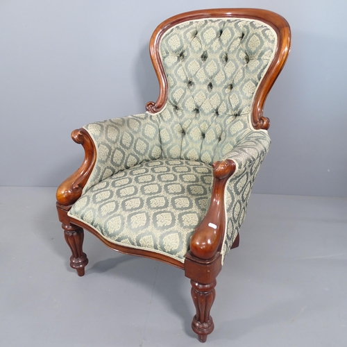 2269 - A Victorian style mahogany and upholstered spoon back armchair.