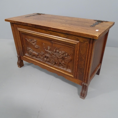 2271 - A small oak blanket box with applied carved figural decoration. 79x48x36cm.