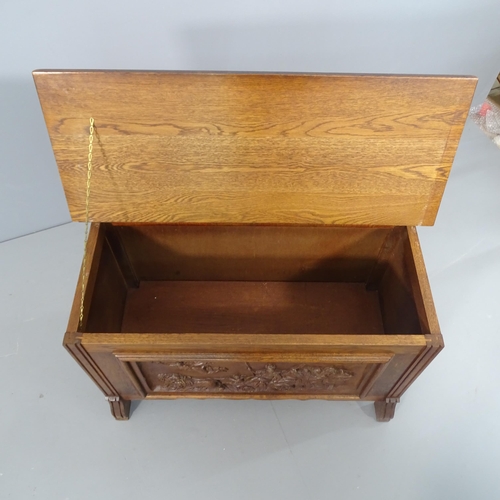 2271 - A small oak blanket box with applied carved figural decoration. 79x48x36cm.