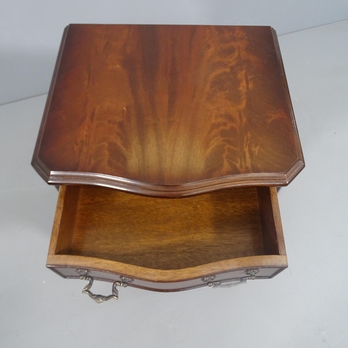 2279 - A small mahogany serpentine fronted chest of 4 drawers.  40x62x36cm.