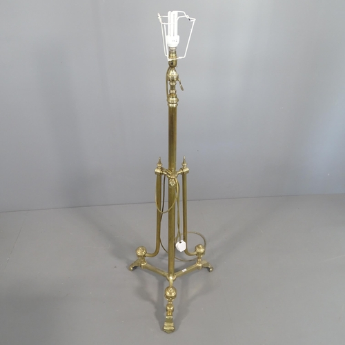 2290 - A telescopic brass Corinthian style standard lamp on tripod stand. H (tallest - 179cm). With shade.