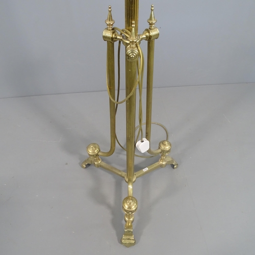 2290 - A telescopic brass Corinthian style standard lamp on tripod stand. H (tallest - 179cm). With shade.