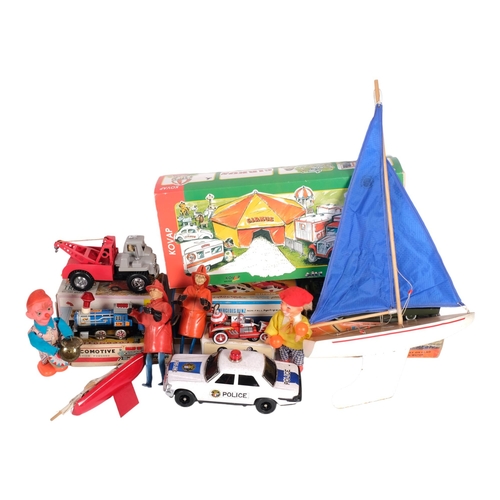 44 - A quantity of Vintage toys, including a Kovap - a German toy circus set no. 0521, a tinplate and pla... 