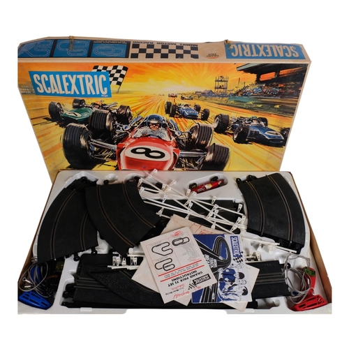 63 - SCALEXTRIC - a boxed Grand Prix 75 set, appears complete and with original vehicles, associated inst... 