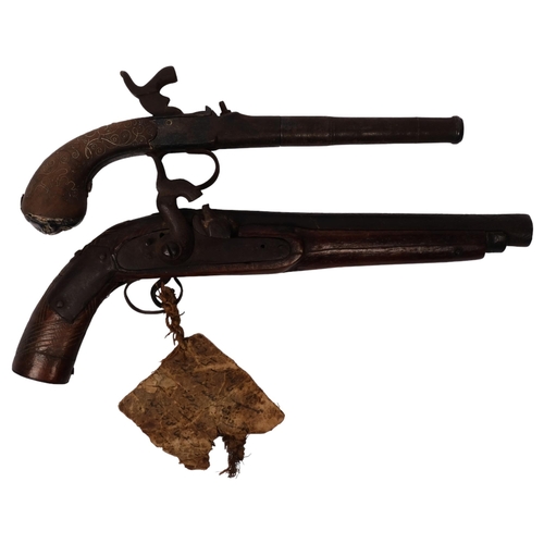 290 - An 18th century percussion pistol, engraved barrel and handle, not working, and a 19th century Middl... 