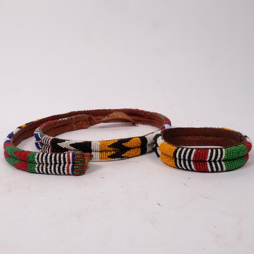 295 - A Nigerian coloured beadwork and leather belt, and matching bracelet