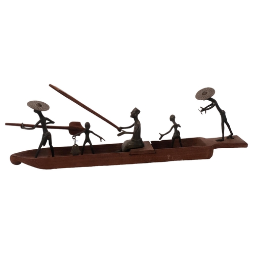 298 - A group of Nigerian bronze fisherman figures and boat, L43cm