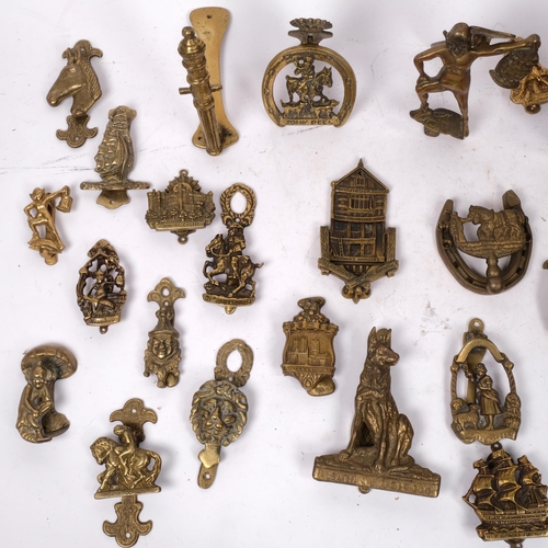 349 - A large quantity of brass door knockers, including a Dartmoor Pisky, the Norseman etc