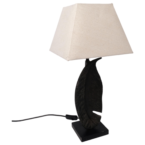 366 - A contemporary cast-metal table lamp in the form of a feather, with LED bulb, and shade, overall hei... 