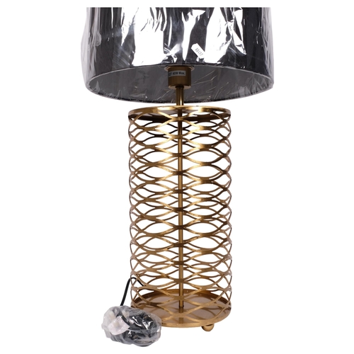 370 - A contemporary table lamp and shade, with a pierced open latticework body, overall height 73cm