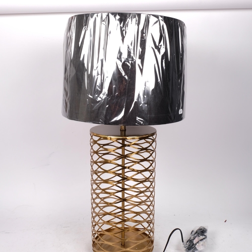 370 - A contemporary table lamp and shade, with a pierced open latticework body, overall height 73cm