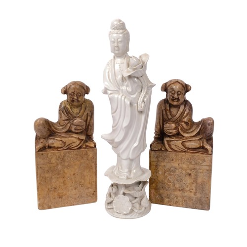 330 - A blanc de chine figure, and a pair of soapstone seals, figure height 26cm