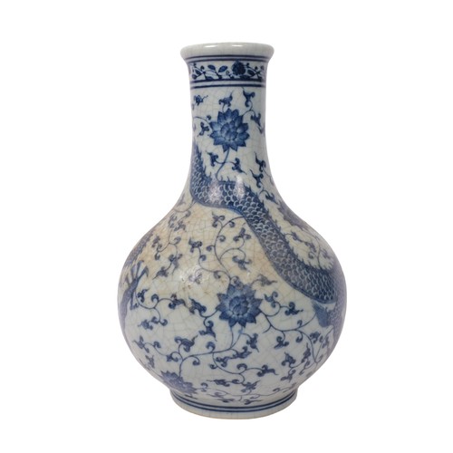 331 - A Chinese blue and white crackle glaze vase with dragon decoration, H26cm