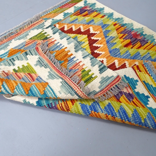 2339 - A Chobi Kilim runner. 150x60, a Chobi Kilim mat, 79x59cm, and another, 48x49cm. (3)