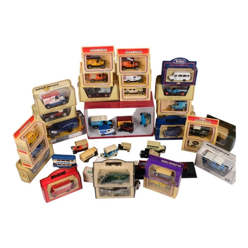 104 - A quantity of diecast vehicles, both boxed and loose, including various items from the Lledo Days Go... 