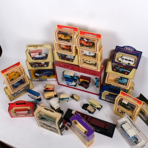 104 - A quantity of diecast vehicles, both boxed and loose, including various items from the Lledo Days Go... 