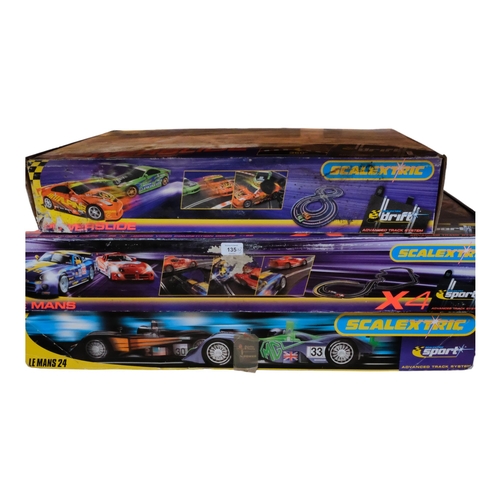 135 - SCALEXTRIC - a group of 3 boxed sets, including Scalextric Power Slide, appears incomplete but with ... 