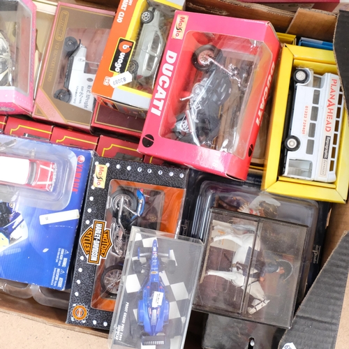 141 - A quantity of boxed diecast vehicles, including such brands as Burago, Maisto, Models of Yesteryear ... 