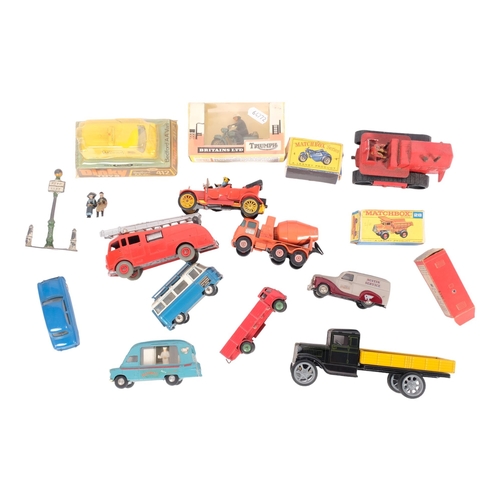 147 - A group of loose diecast vehicles and accessories, including a boxed Britains Ltd Triumph model 9686... 