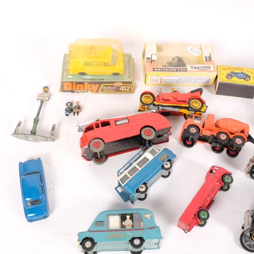 147 - A group of loose diecast vehicles and accessories, including a boxed Britains Ltd Triumph model 9686... 