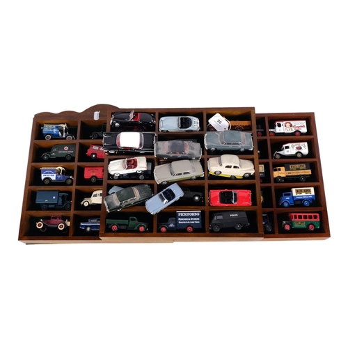 96 - A quantity of loose diecast vehicles, in 3 associated modern display cases, vehicles include many fr... 