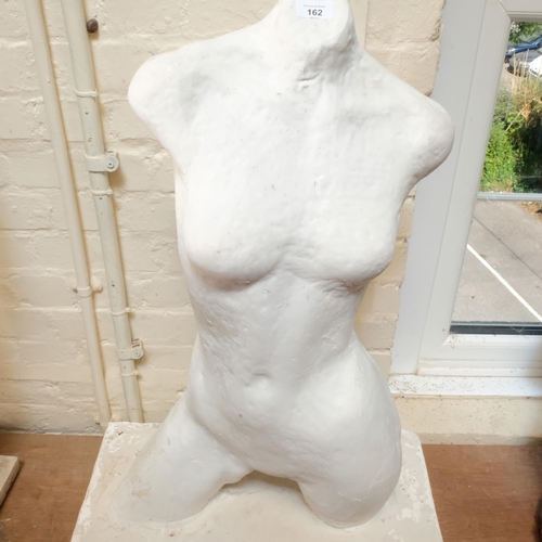 162 - A white painted plaster half sculptural female torso, on rectangular plinth base, W59cm, H88cm