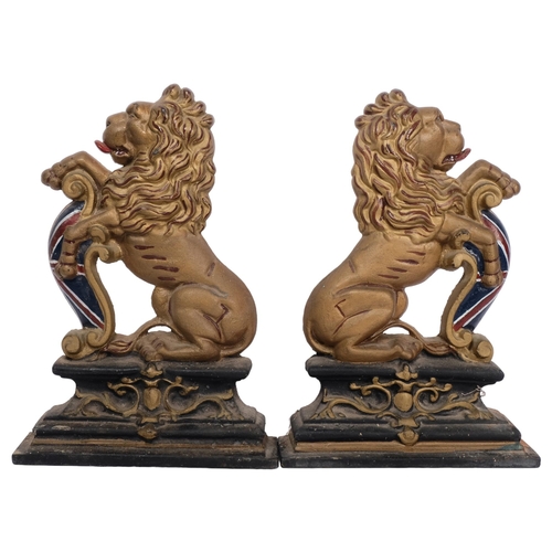 177 - A pair of gilded cast-iron heraldic rampant lion door stops, H36cm