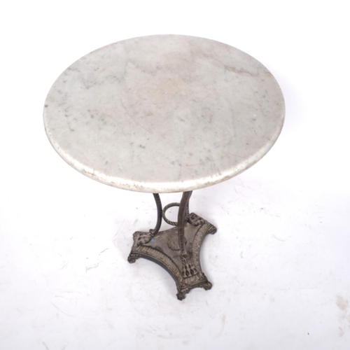 179 - A small circular white and grain veined marble-top side table, sitting on a cast-iron base with Gree... 