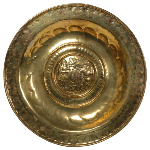 193 - A 16th century Nuremburg brass arms dish, diameter 58cm