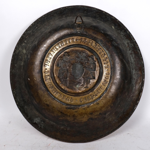 193 - A 16th century Nuremburg brass arms dish, diameter 58cm