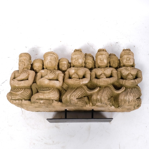 207 - An Oriental composite frieze, depicting 9 kneeling figures, W42cm