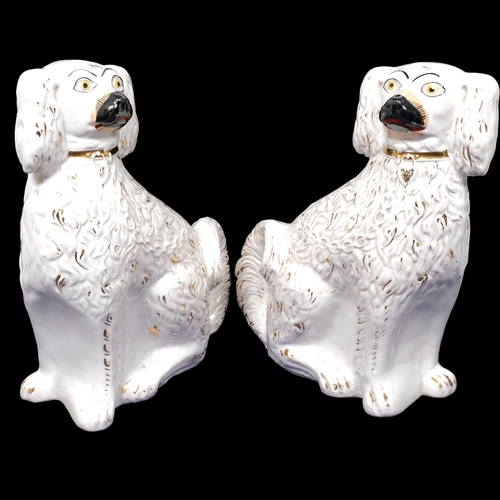 208 - A pair of Victorian Staffordshire mantel Spaniels, H33cm