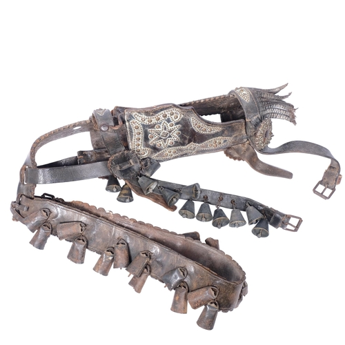 210 - An impressive Victorian leather and studded brass horse's halter with attached bells, length 65cm