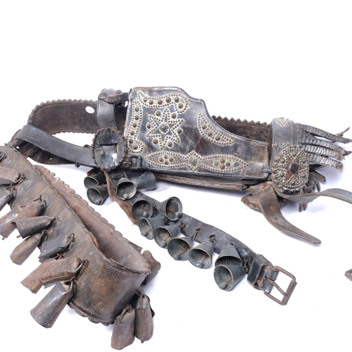 210 - An impressive Victorian leather and studded brass horse's halter with attached bells, length 65cm