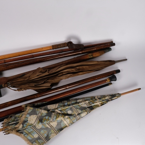 253 - A group of canes, walking sticks and parasols, including a silver collared