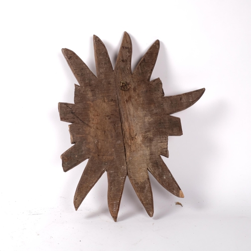 255 - A Gothic carved oak sun/moon wall sconce, diameter 50cm