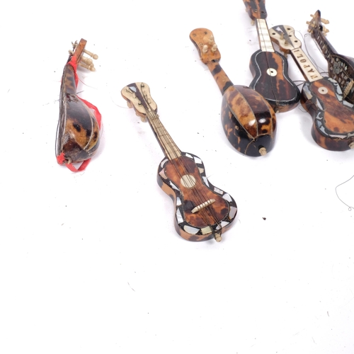 265 - A collection of miniature Italian tortoiseshell and mother-of-pearl mandolins and guitar (9)