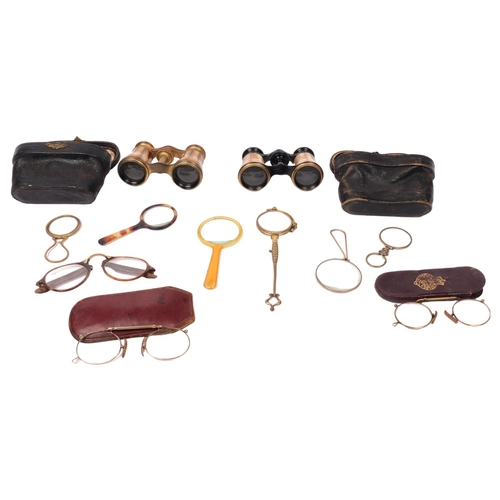 274 - A pair of French gilt-metal opera glasses, cased, and another pair, magnifying glasses, pince nez et... 