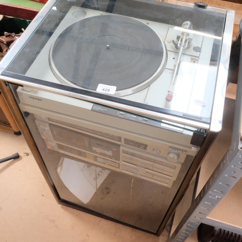 428 - A Sony Music system, in glass-fronted case, including a Sony direct drive turntable PS-LX33