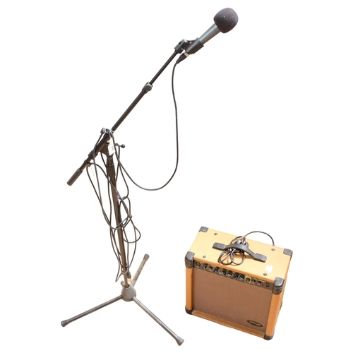 429 - A Shure Beta 58A microphone, with an on-stage tripod stand, together with a Stagg 40 watt amplifier