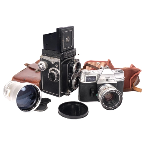 459 - A Yashica 635 medium format TLR camera, serial no. 3890399, and a Kodak Retina Reflex IV, with assoc... 